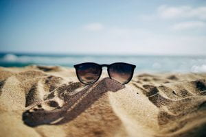 picture of glasses on a beach 